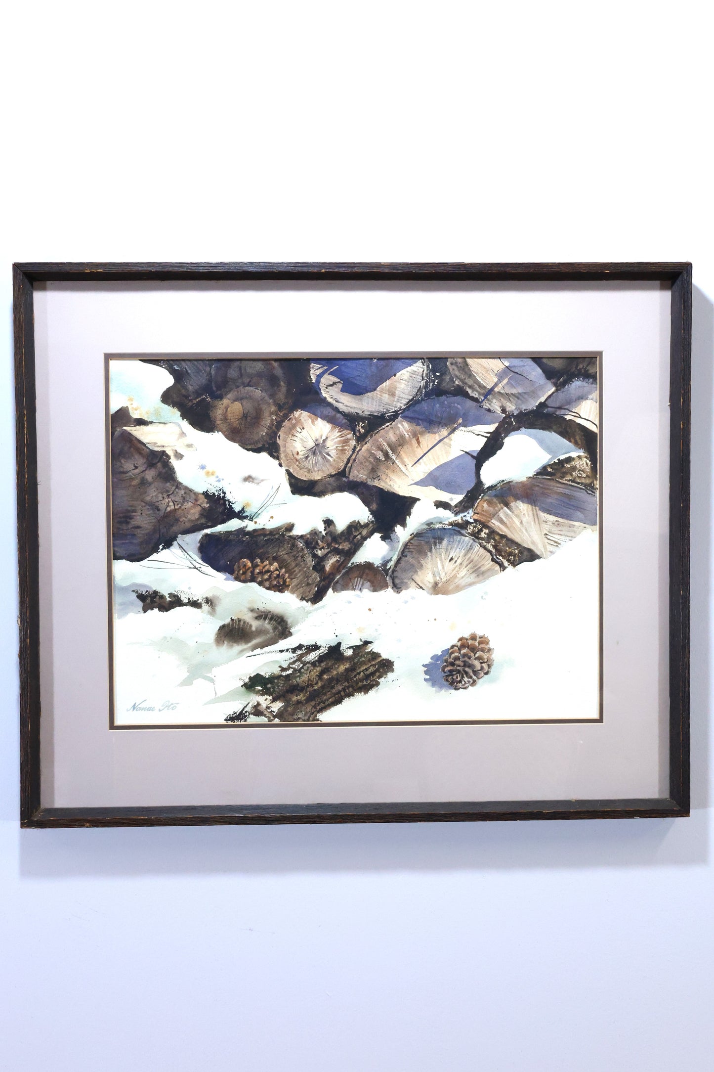 Winter Landscape with Stacked Logs and Pinecones by Nanae Ito